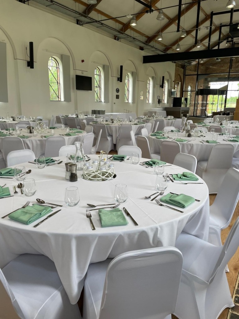 white linen round tables