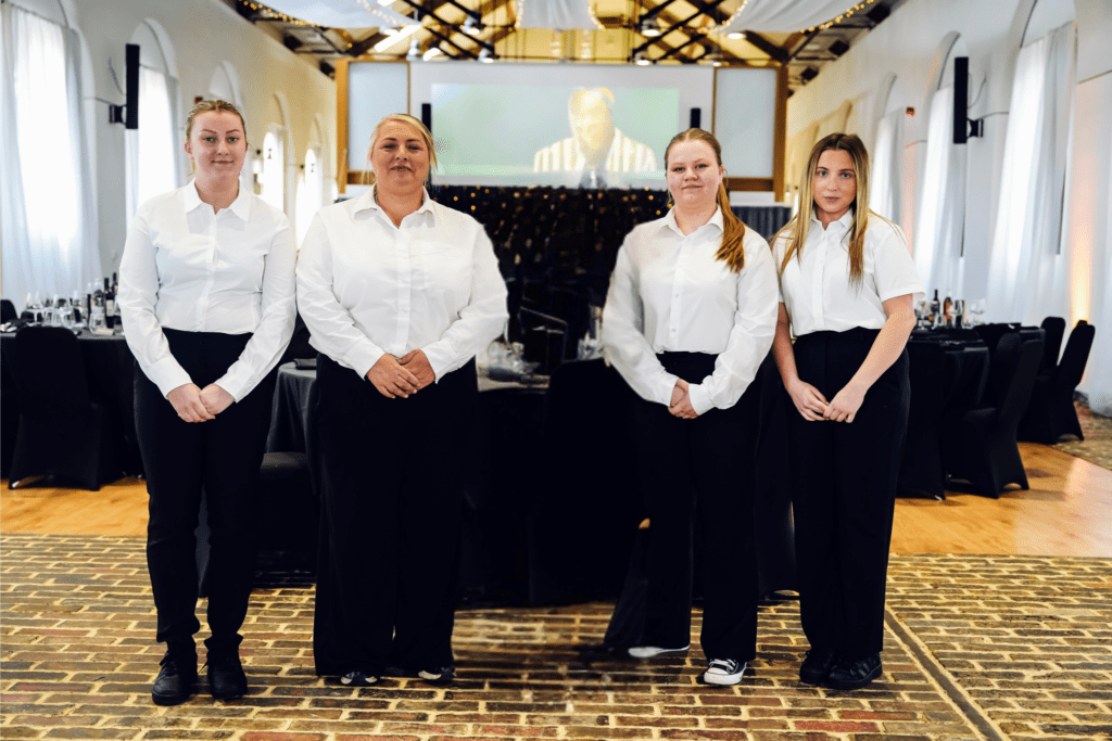 white shirt black trouser catering team